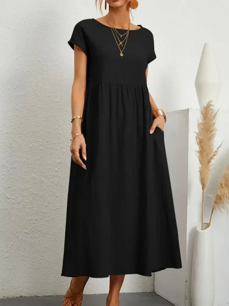 Versatile women's casual maxi dress with a flattering smock waist and relaxed short sleeves.