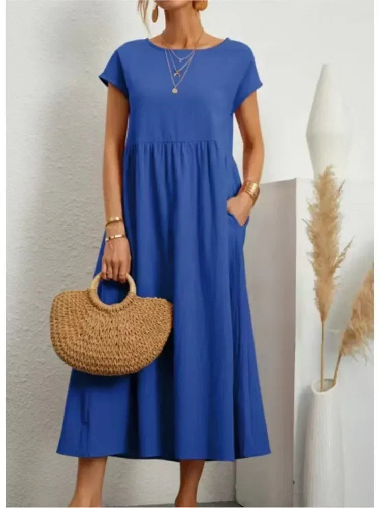 Relaxed fit women's short sleeve maxi dress, featuring a comfortable smock waist for effortless style.