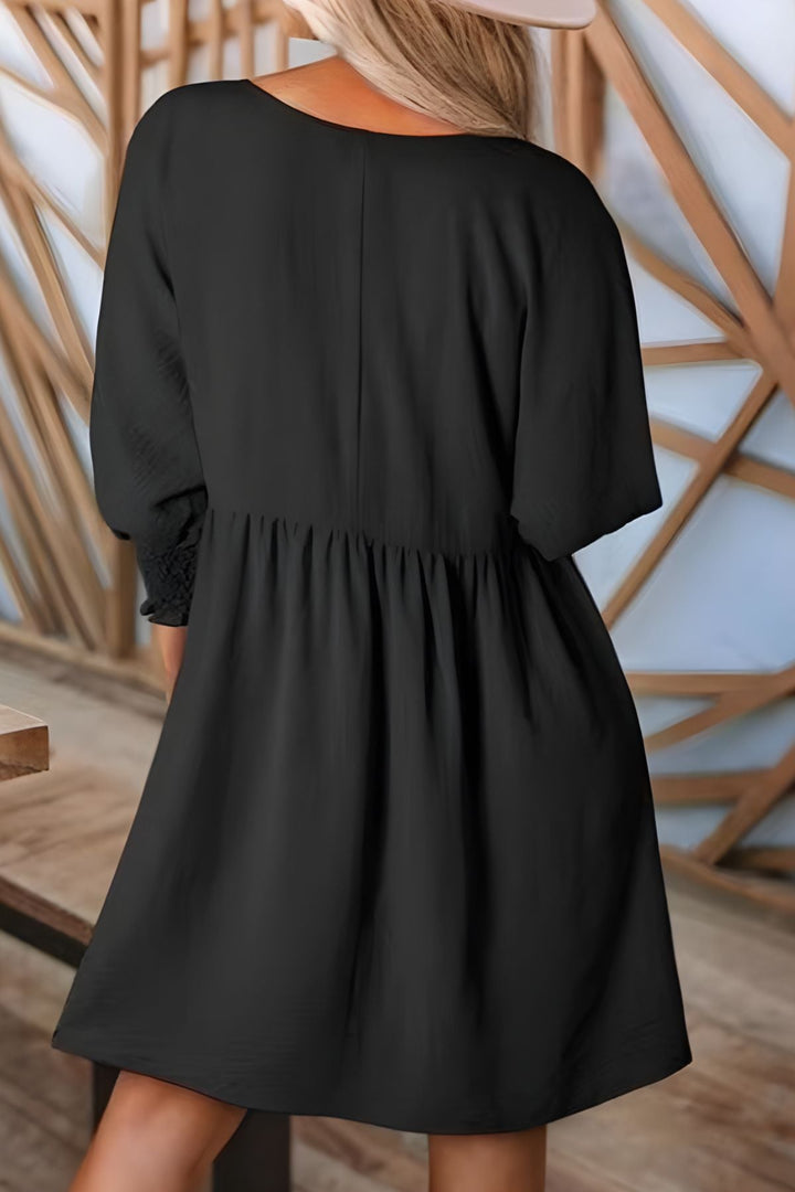 Shop women's versatile babydoll mini dress with smocked half sleeves and stylish ruffle accents.