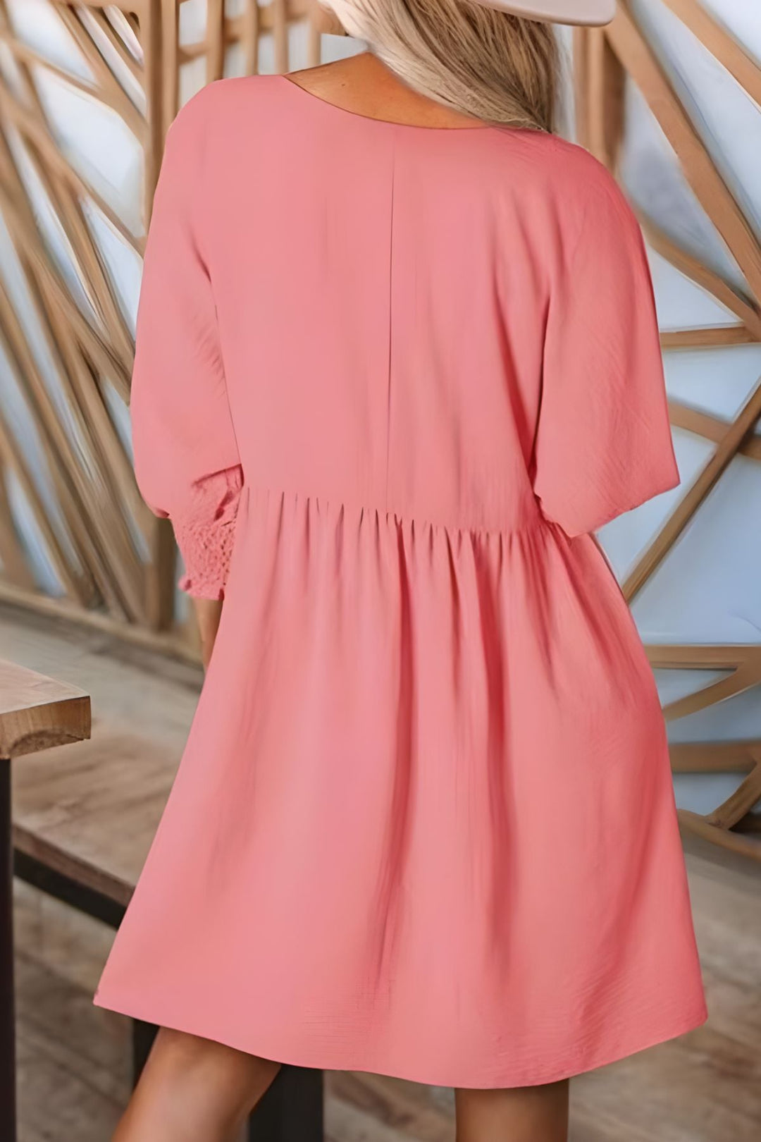 Trendy women's half-sleeve babydoll mini dress, smocked cuffs, ruffled design, perfect casual look.