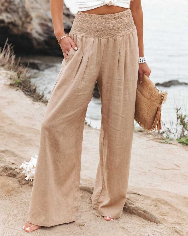 Women's smocked high waist wide leg pants, a comfortable and chic option for casual spring/summer style.
