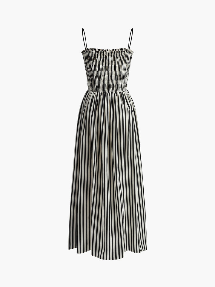 Chic women's strappy pinstripe maxi dress, featuring a smocked design for summer elegance.