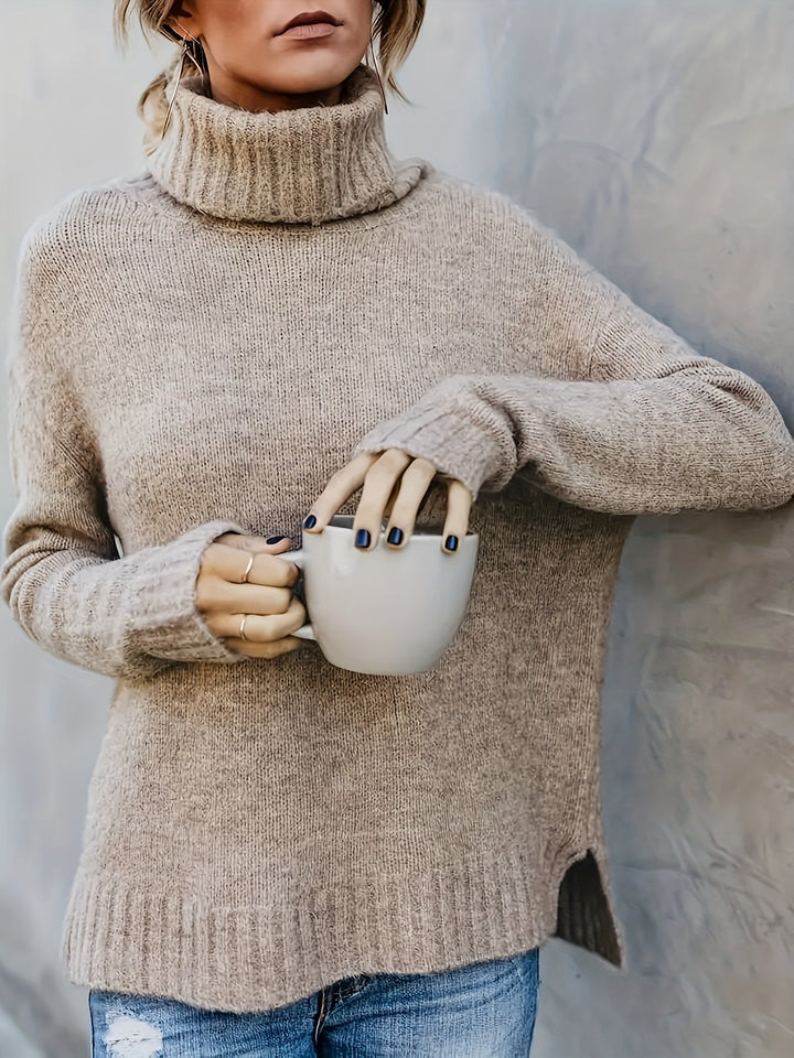 Classic women's turtleneck sweater, relaxed fit. Modern split hem for versatile styling.