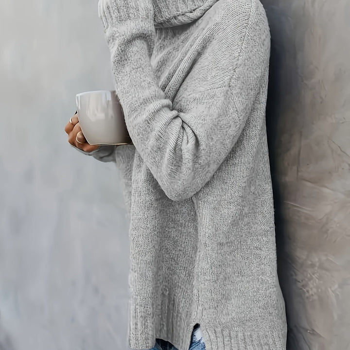Warm women's turtleneck pullover. Features a stylish split hem, great for comfortable layering.