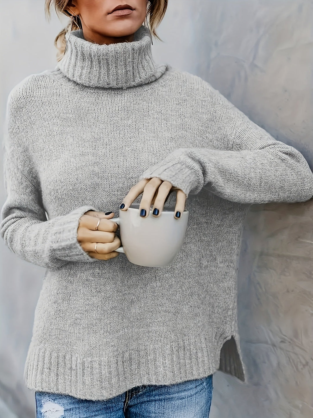 Soft knit women's turtleneck pullover. Features modern split hem, great for everyday casual wear.
