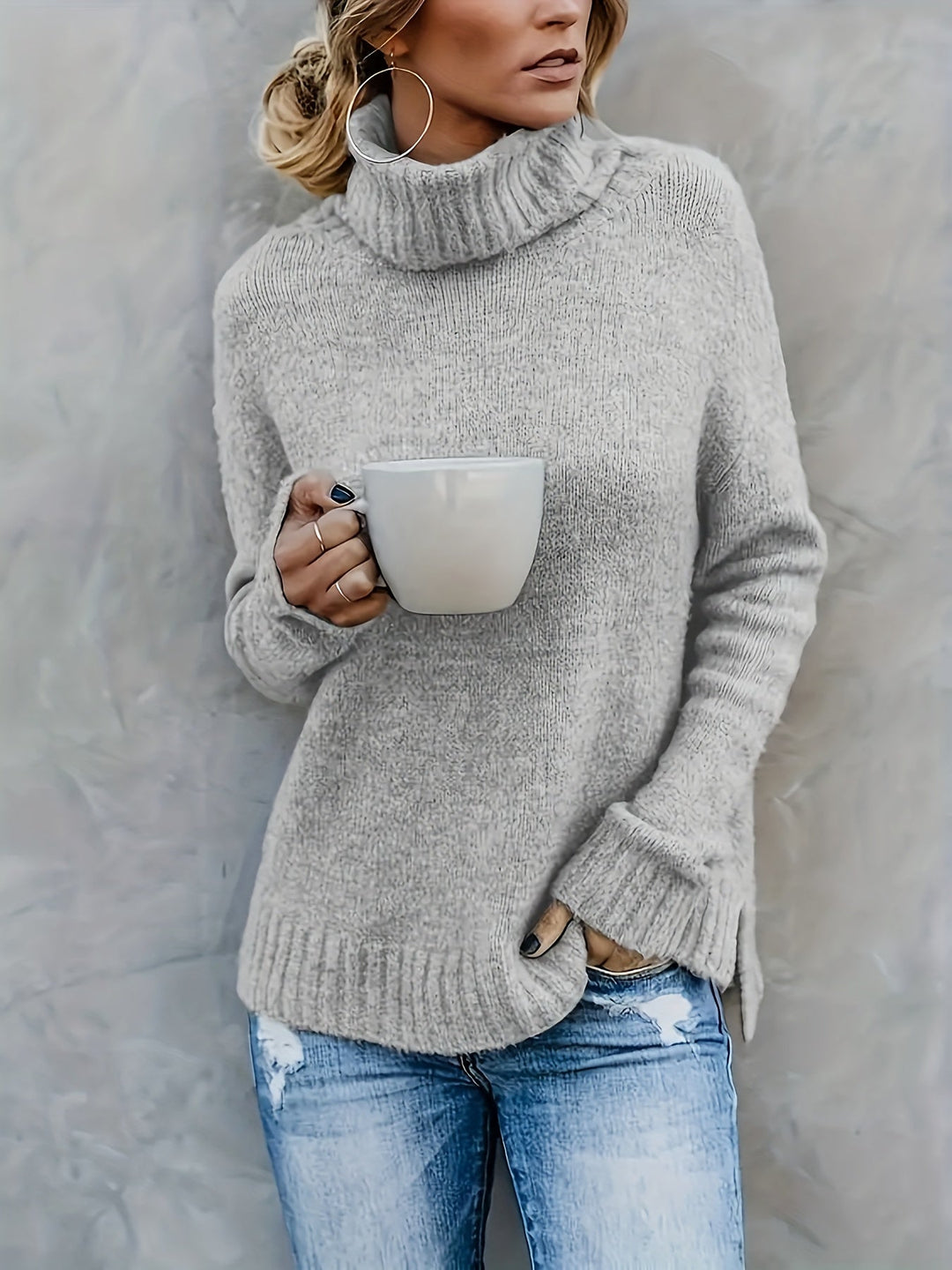 Cozy women's pullover turtleneck sweater. Effortless split hem design for autumn fashion.