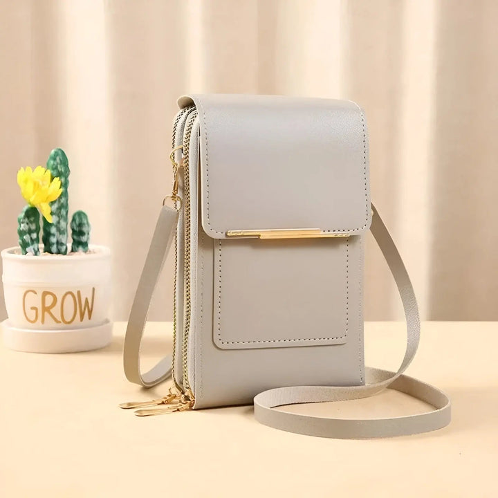 Black soft leather anti-theft shoulder bag for women. Secure ladies' handbag with robust zippers.