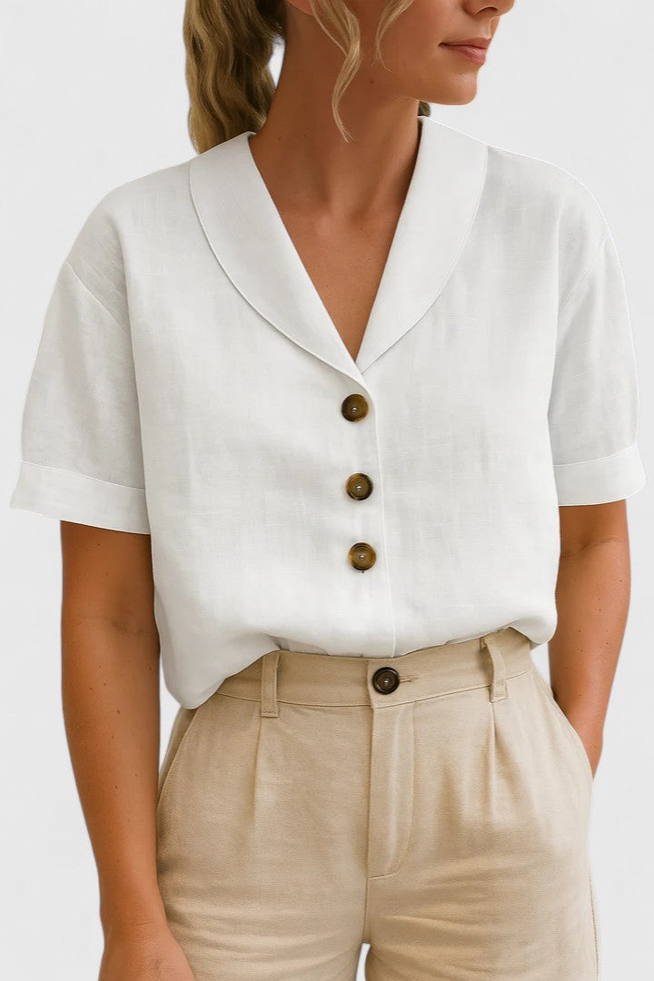 Sophisticated women's collared button-up blouse. An elegant long sleeve top for modern spring fashion.