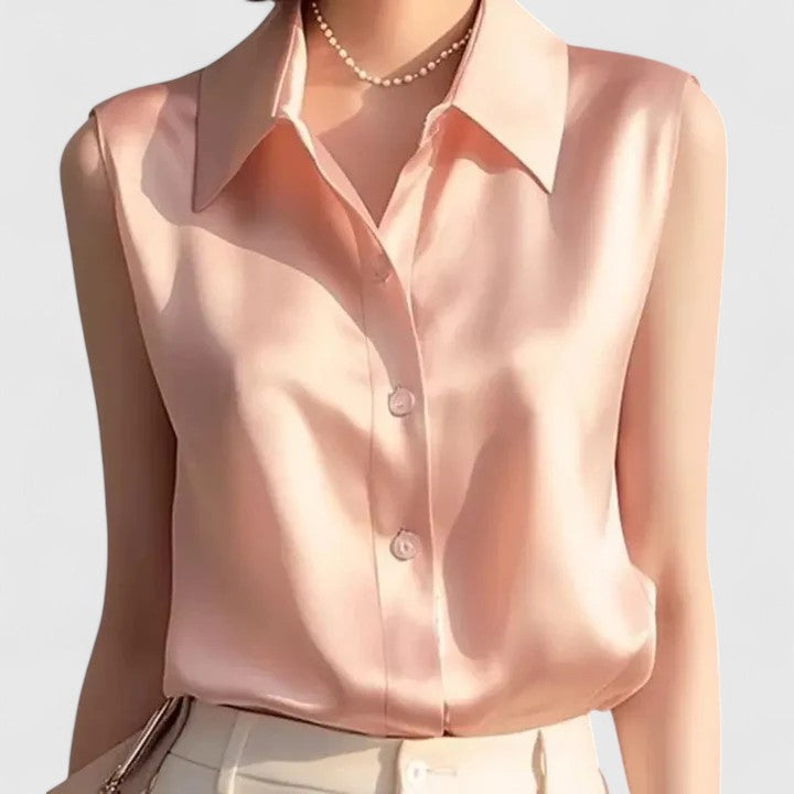 Women's sophisticated sleeveless blouse, elegant office wear for a chic, professional look. Lightweight button-up shirt.