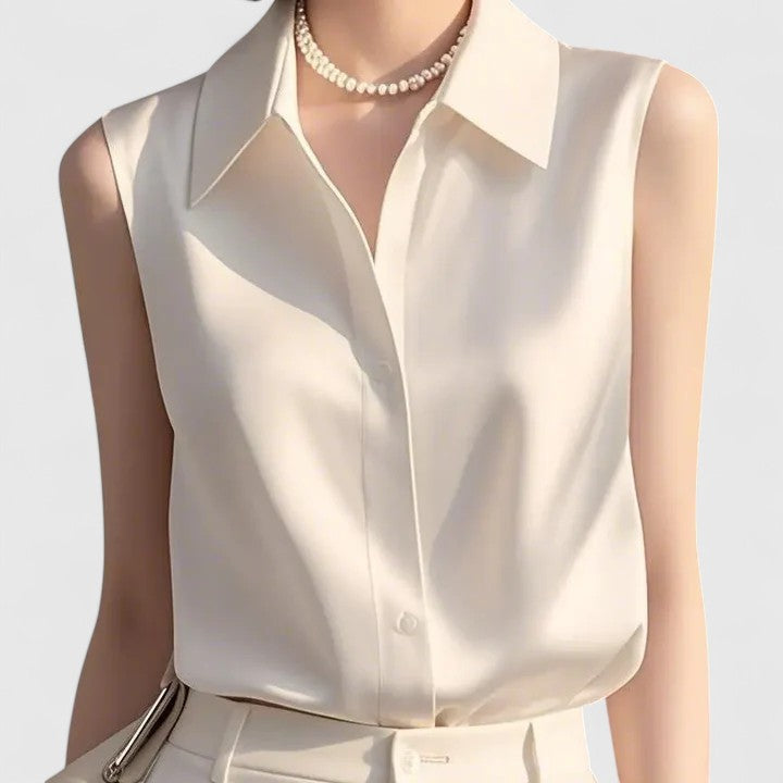 Versatile women's sleeveless blouse, perfect for elegant summer fashion or professional office attire. Polished ladies top.
