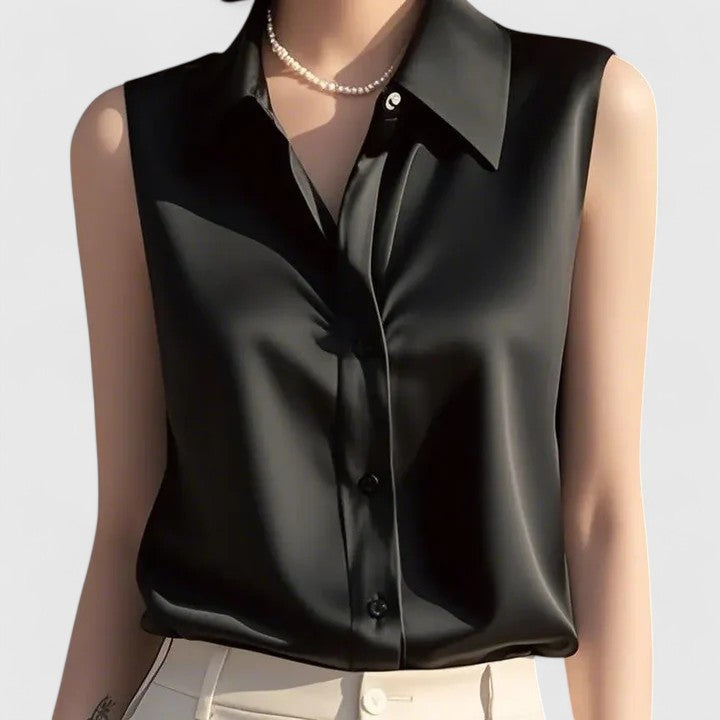Sophisticated women's sleeveless blouse, ideal for elegant office fashion or versatile summer wear. Polished ladies top.