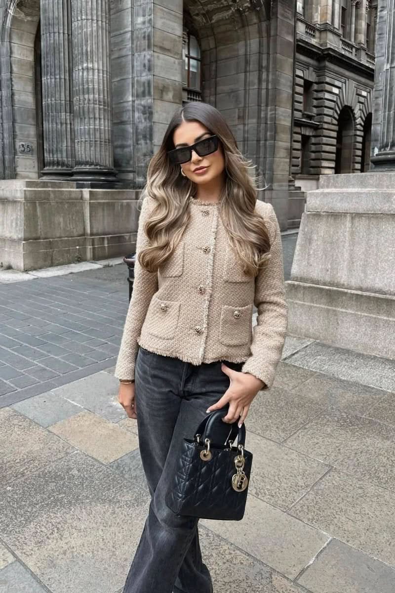 Women's sophisticated button blazer, tailored for a chic, professional look suitable for any formal setting.