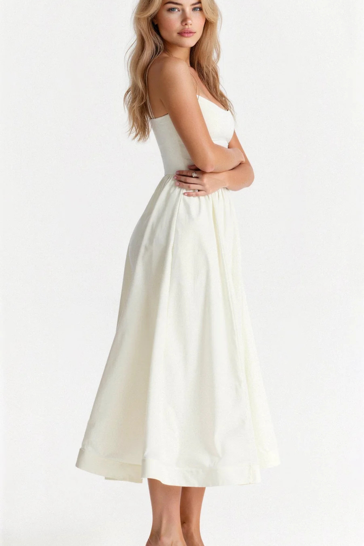 Classic women's spaghetti strap midi sundress, embodying effortless elegance for warmer weather.