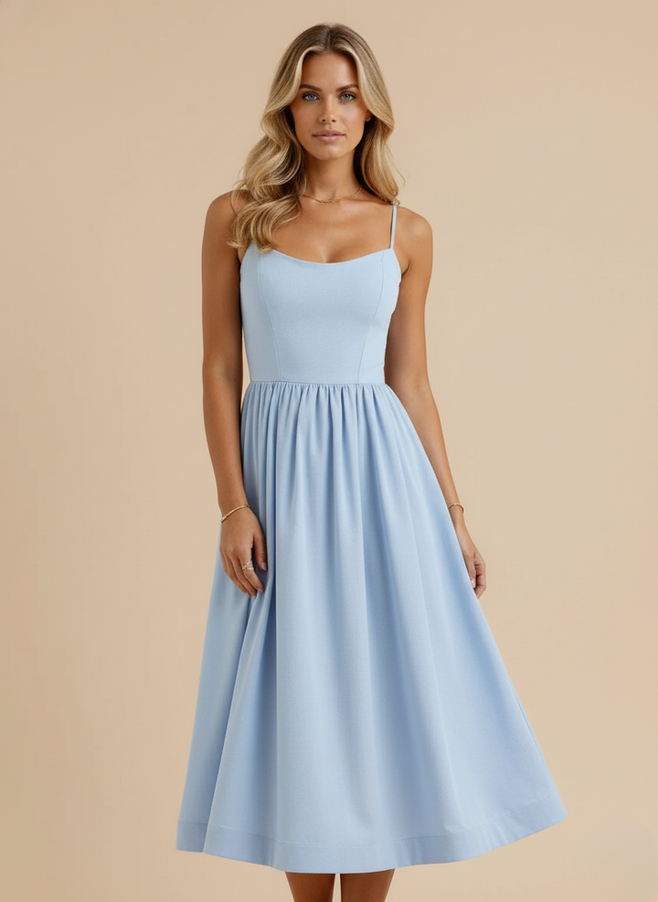 A-line midi dress for women featuring spaghetti straps & a scoop neck. A flattering & chic summer outfit.