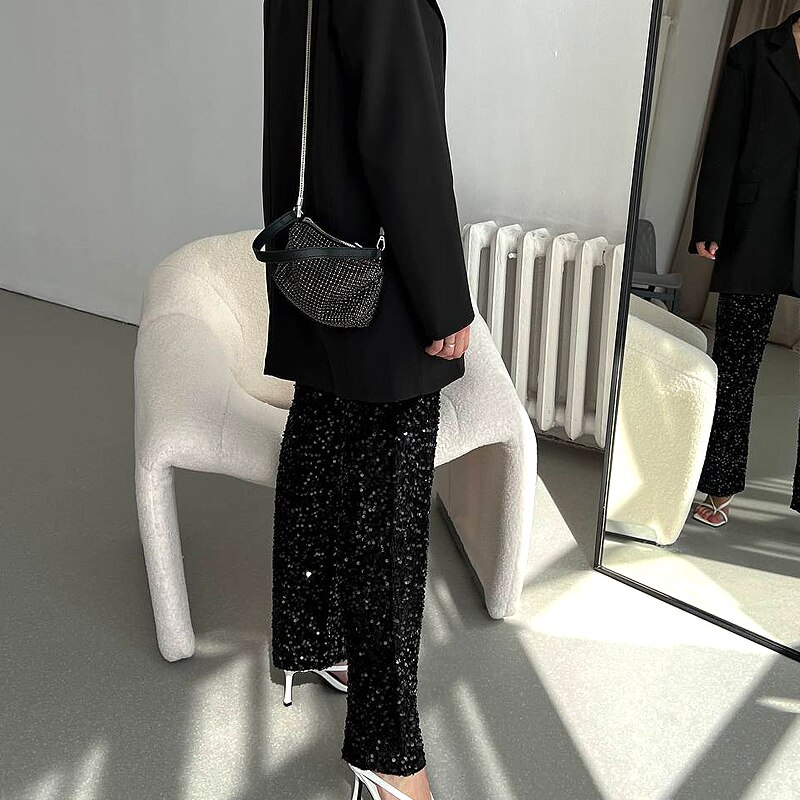Shiny women's high-waist party pants, a fashion statement piece for festive occasions & club nights.