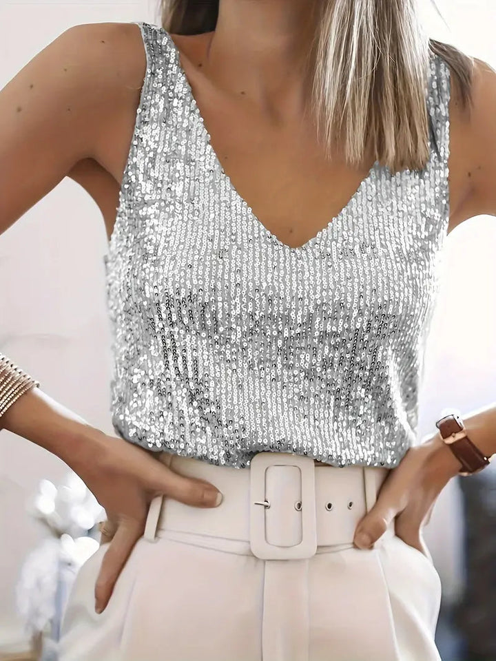 Trendy women's sleeveless sequin V-neck top, sparkling for a night out or special event.