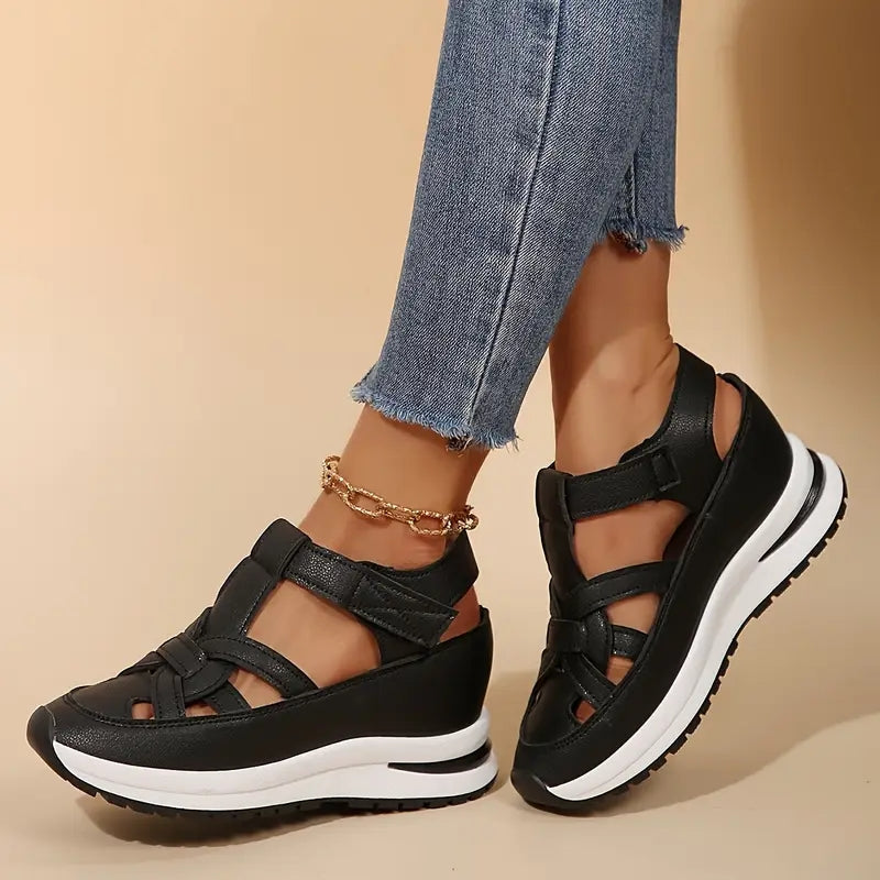 Chic women's platform sandals with cutout straps, offering comfortable and adjustable sporty summer style.
