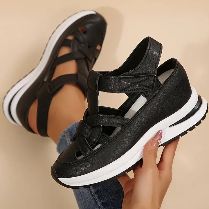 Modern women's open-toe platform sandals with sporty cutout straps, perfect for casual summer wear.