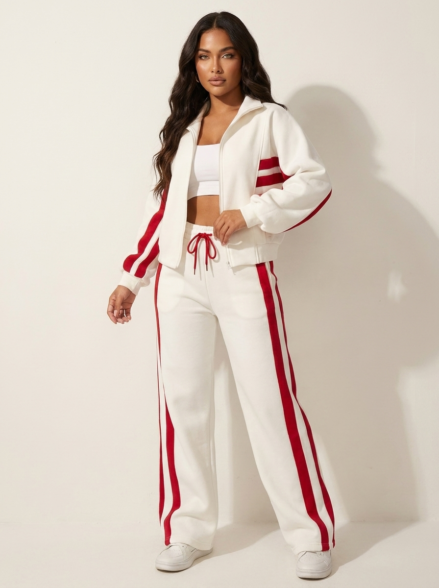 Comfortable women's two-piece lounge wear tracksuit with chic contrast stripe design, ideal for relaxing.