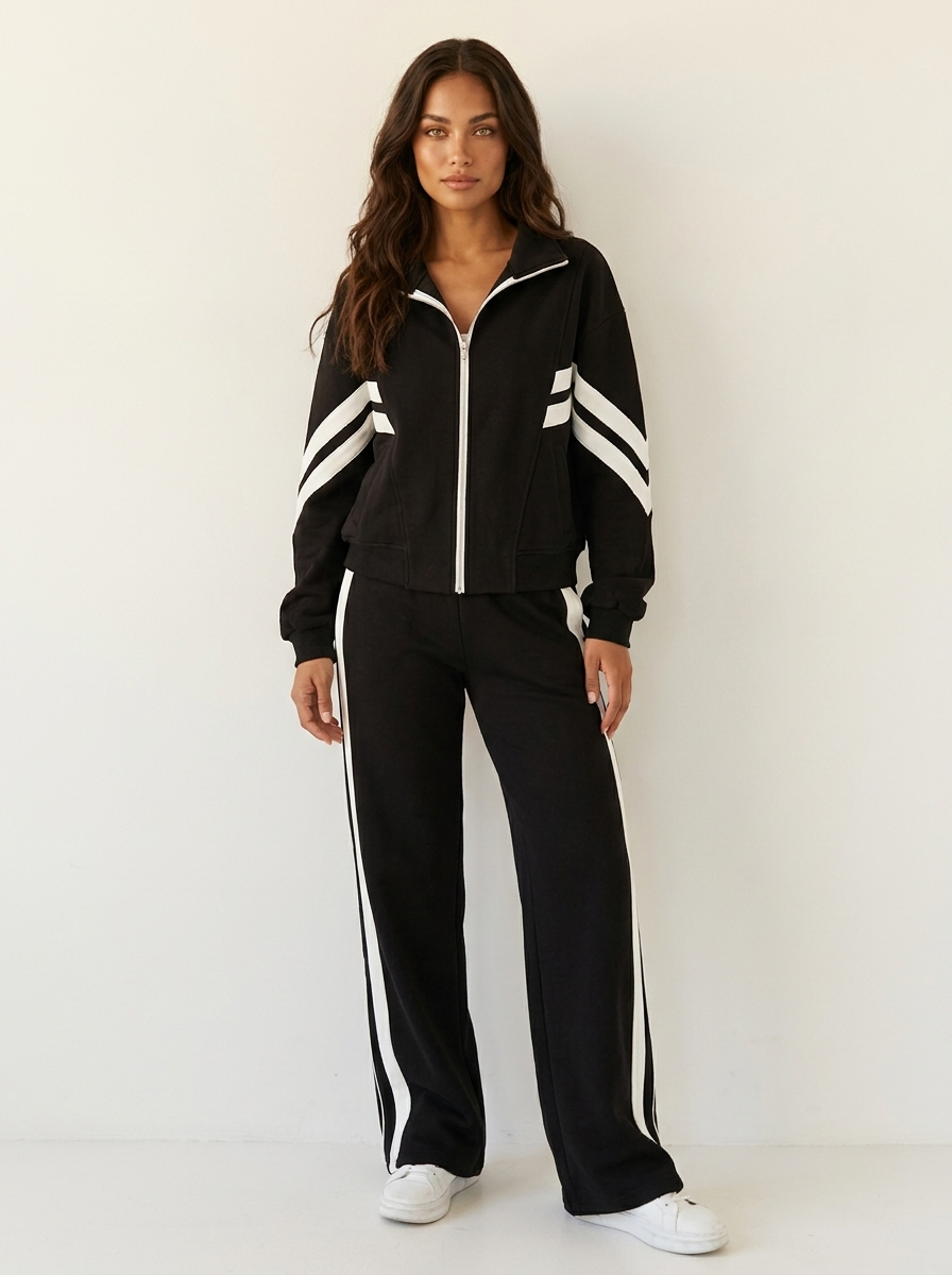Athletic women's coordinated tracksuit set, features a stylish contrast stripe jacket & wide leg trousers.