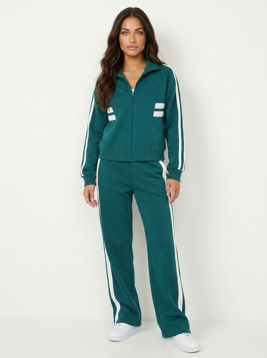 Womens zip-up jacket & wide leg pants tracksuit with bold contrast stripes for a chic, sporty look.