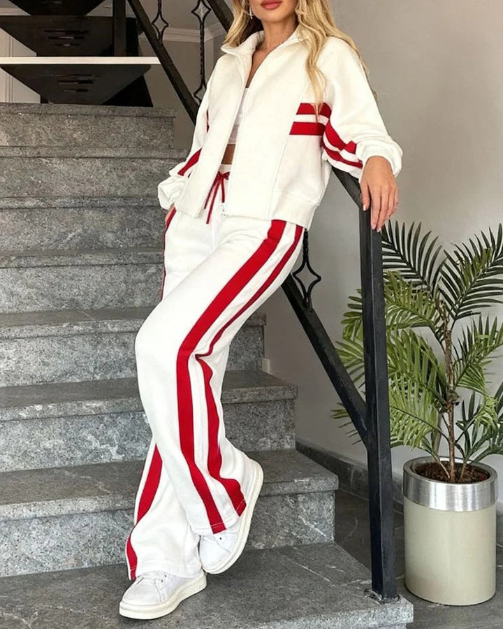 Stylish womens contrast stripe tracksuit set, a comfortable two-piece with a zip jacket & wide leg bottoms.