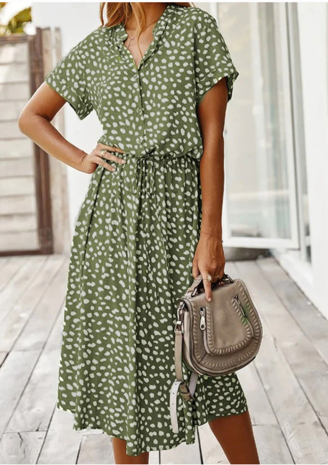 Flowy spotted midi dress for women, featuring a comfortable drawstring waist, V-neck, and flutter sleeves.