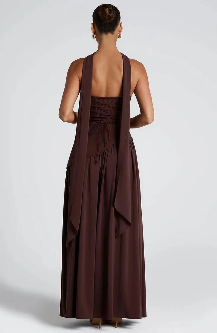 Women's strapless formal maxi dress, flowing and chic with an asymmetric hemline.