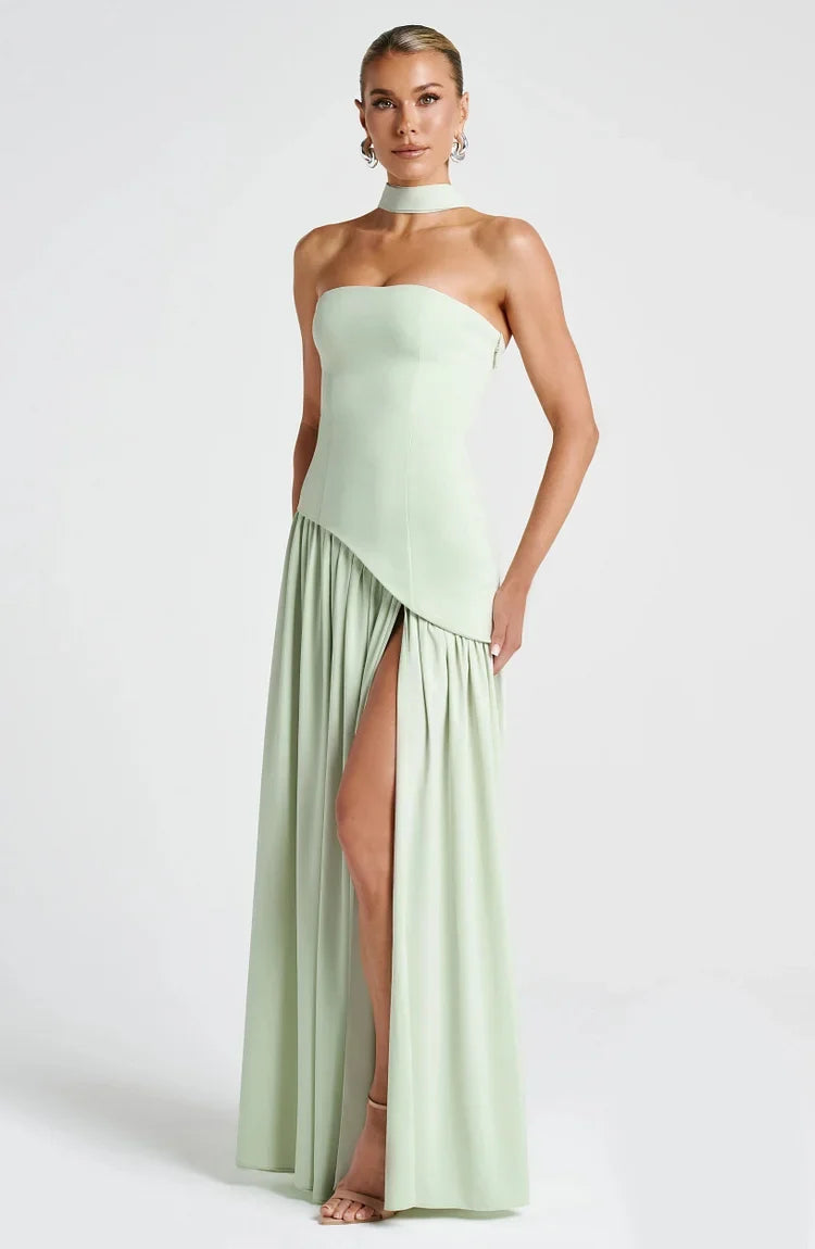 Sophisticated women's strapless evening wear, an asymmetric flowing maxi dress.