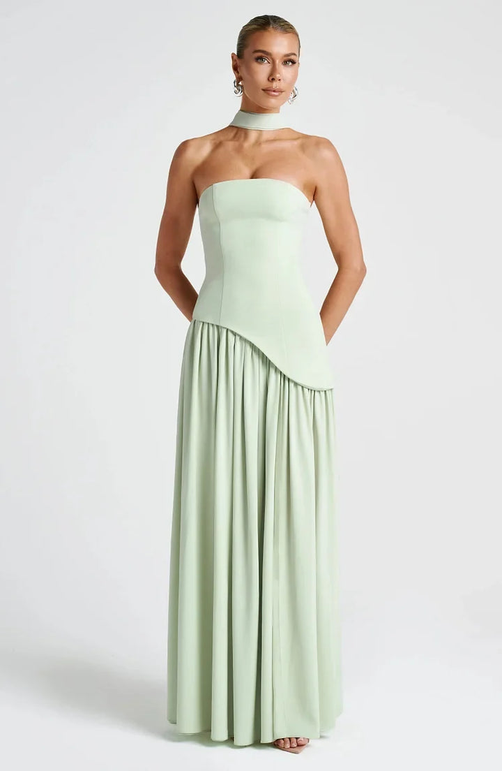 Flowing strapless maxi dress for women, elegant and party-ready with asymmetric cut.