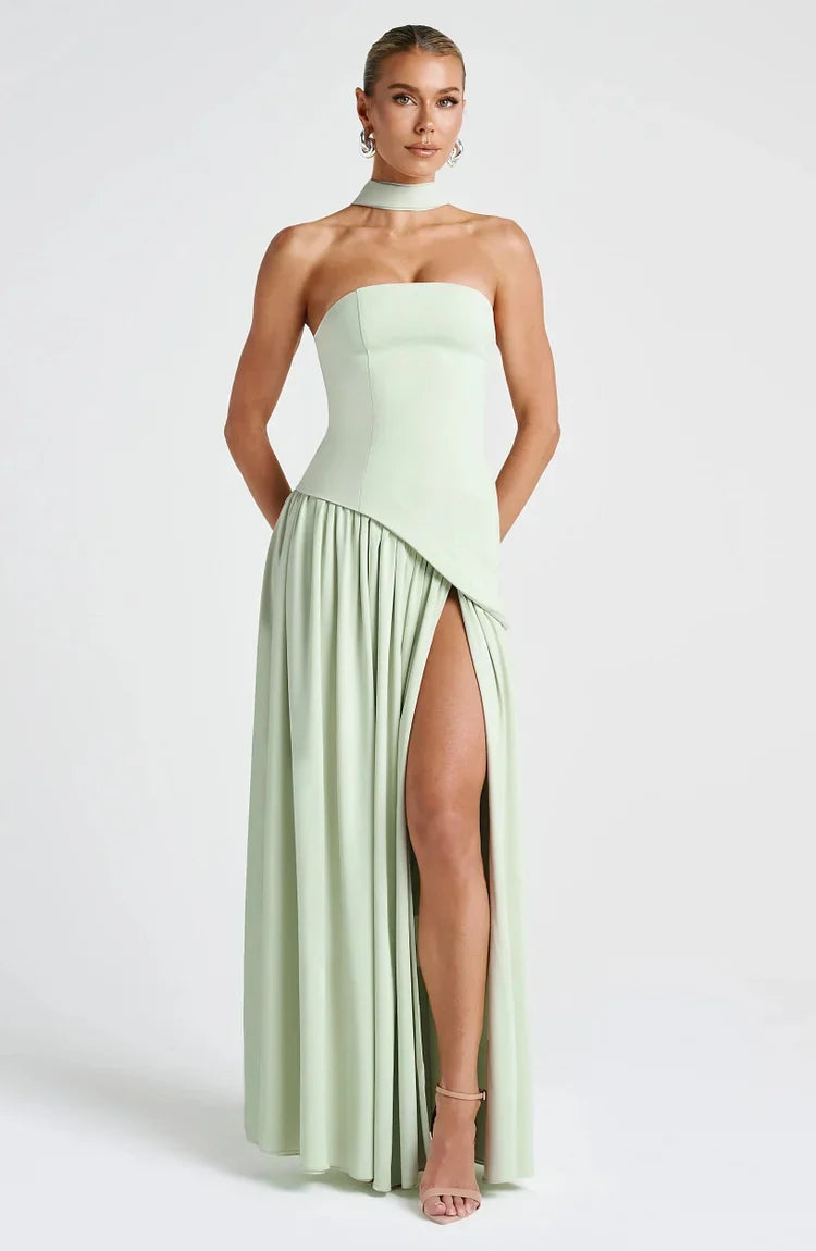 Chic women's strapless maxi dress with an asymmetric hem, perfect for formal events.