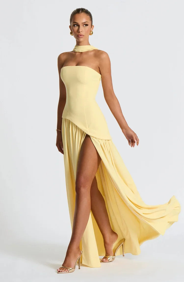 Women's formal strapless gown, flowing maxi style with a captivating asymmetric hem.