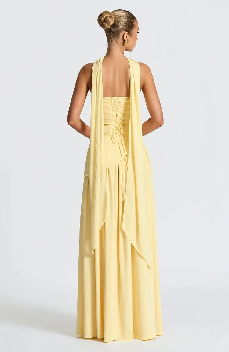 Beautiful strapless party maxi dress for women, featuring a flowing asymmetric skirt.