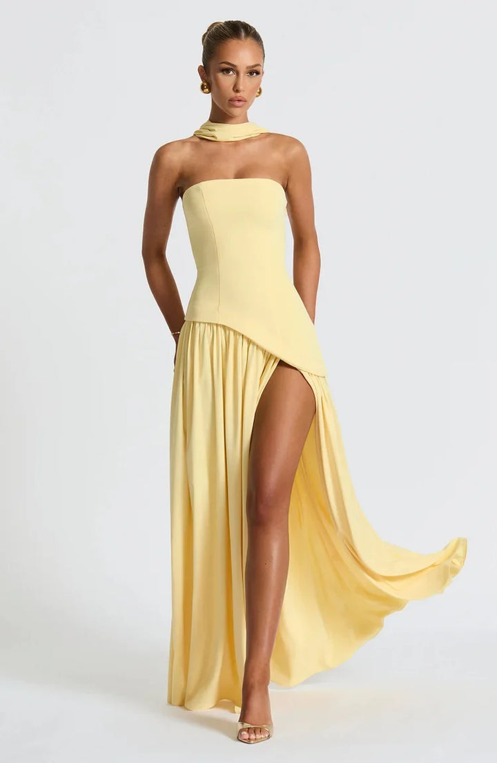 Sophisticated women's strapless maxi, an asymmetric flowing dress for elegant fashion.