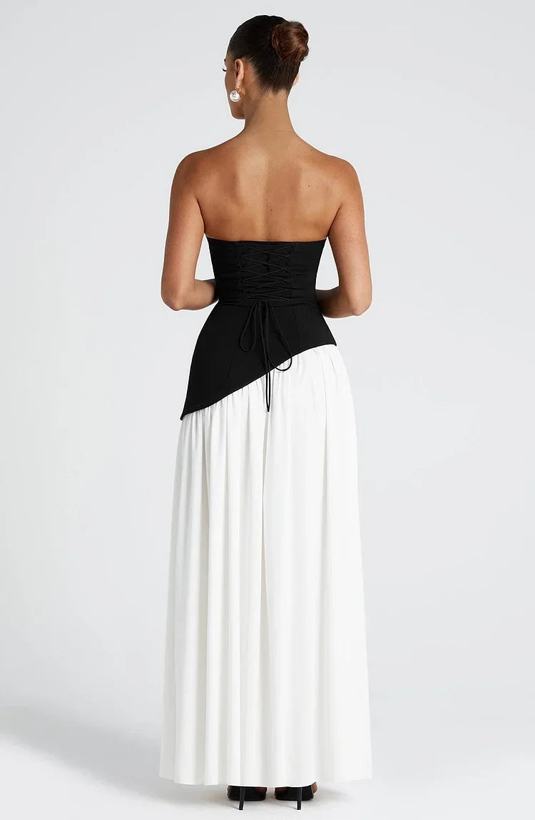 Elegant strapless evening gown with a flowing asymmetric maxi skirt for women.