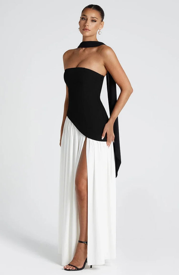 Stylish strapless party dress for women, a flowing maxi with asymmetric details.