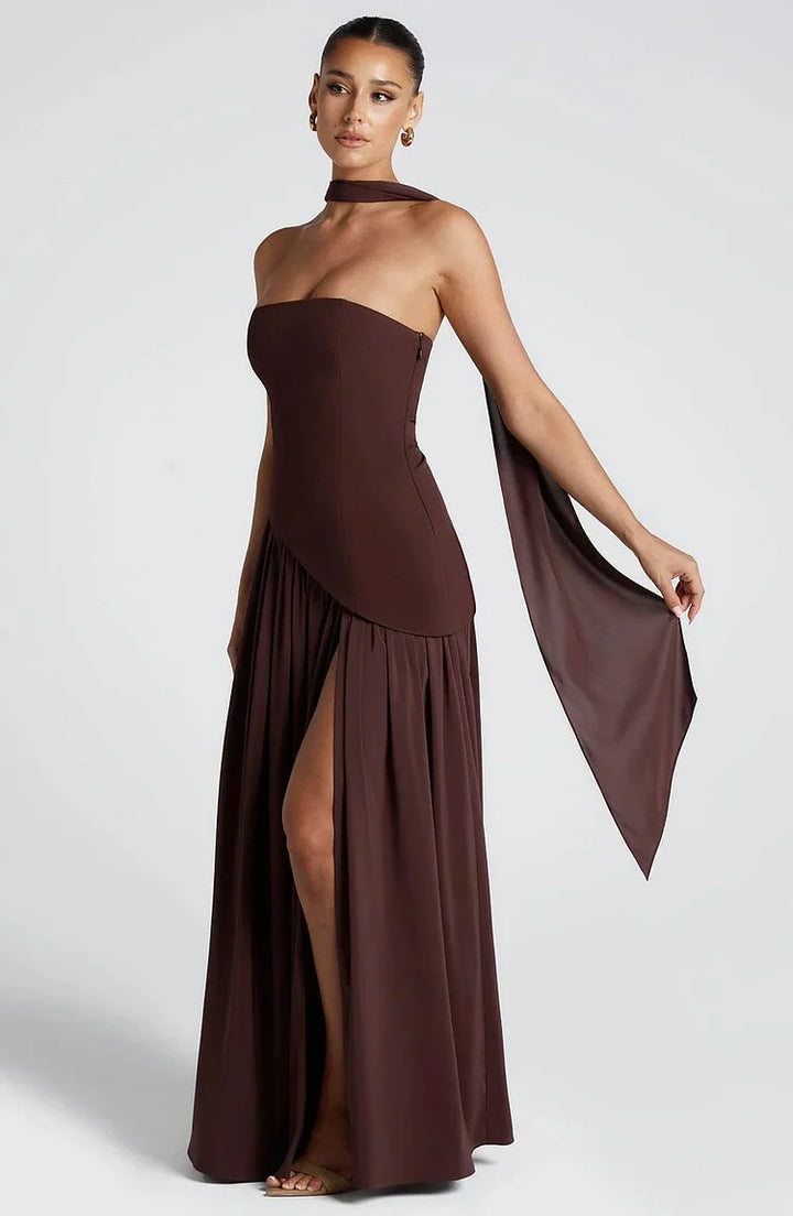Flowing women's strapless maxi dress, an elegant choice with asymmetric design.