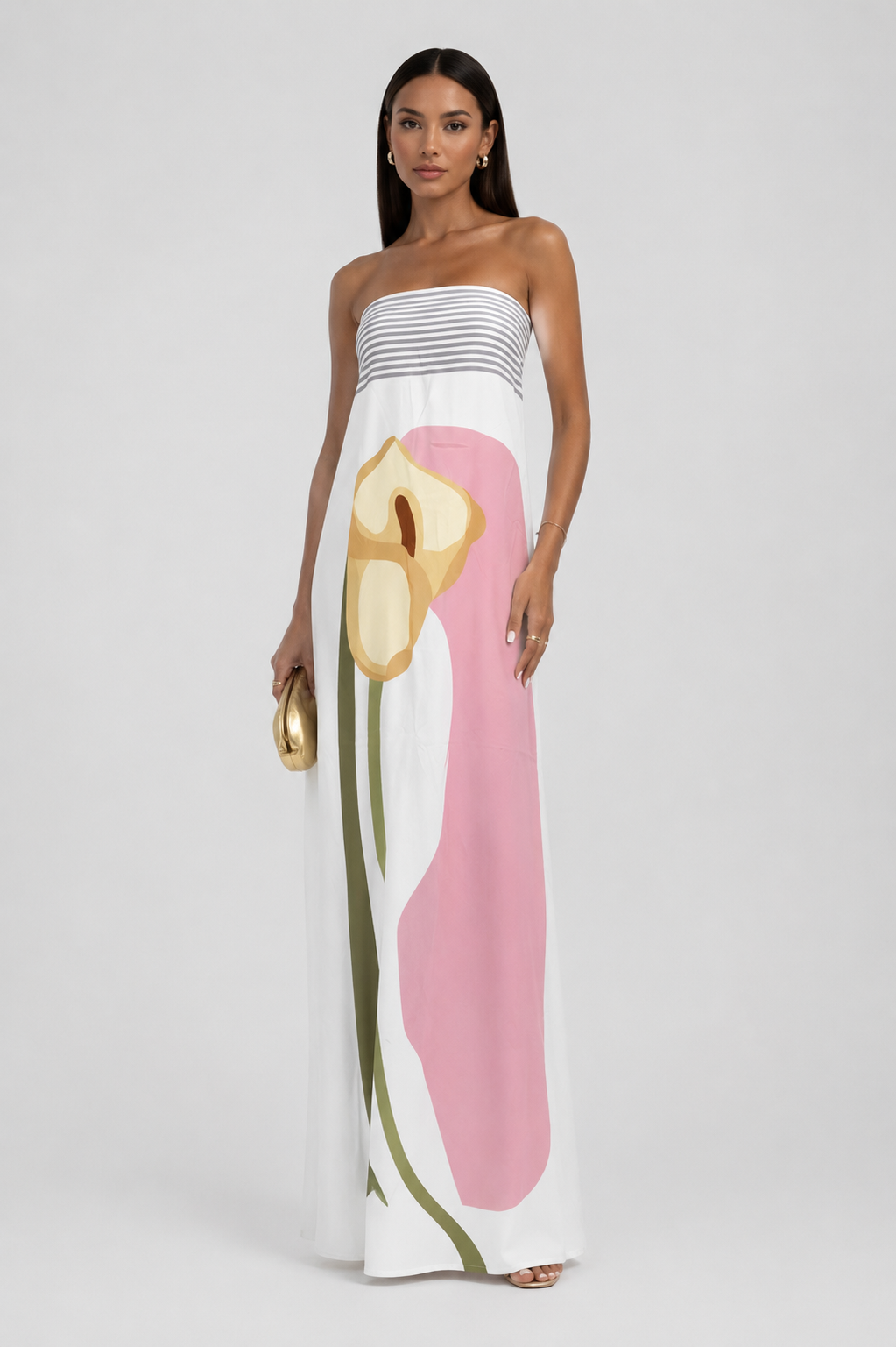Fashionable women's strapless maxi dress. Features a vibrant, eye-catching pattern for summer and beach style.