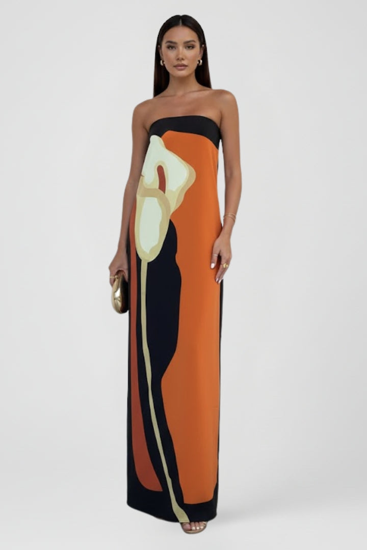 Beautiful women's strapless maxi dress. Features a vibrant pattern, making it a stunning summer beach outfit.