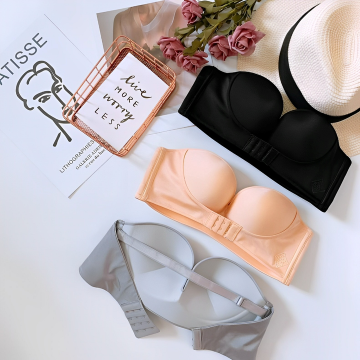 Seamless strapless push-up bra for women, providing invisible support under fashion apparel.