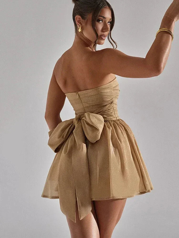 Glamorous strapless mini skater dress, dazzling with sparkle. Ideal for homecoming, cocktail parties, or proms.