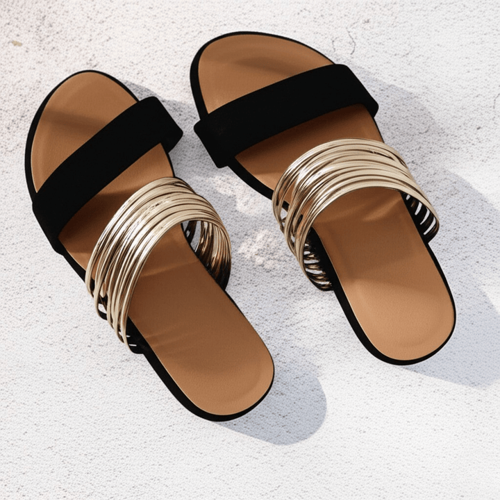 Versatile women's slip-on flat summer sandals with a stylish strappy design, comfortable for beach and everyday use.
