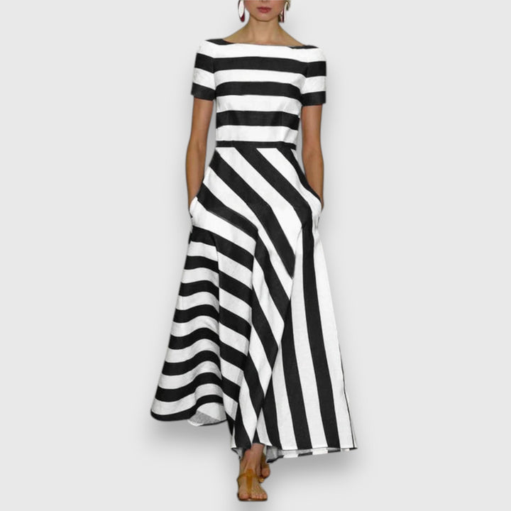 Comfortable women's striped A-line maxi dress featuring a stylish bateau neck & practical pockets. Great for day or party.