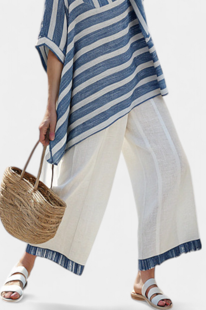 Fashionable women's striped batwing top & wide leg pant set. A chic coordinated outfit for resort or everyday.
