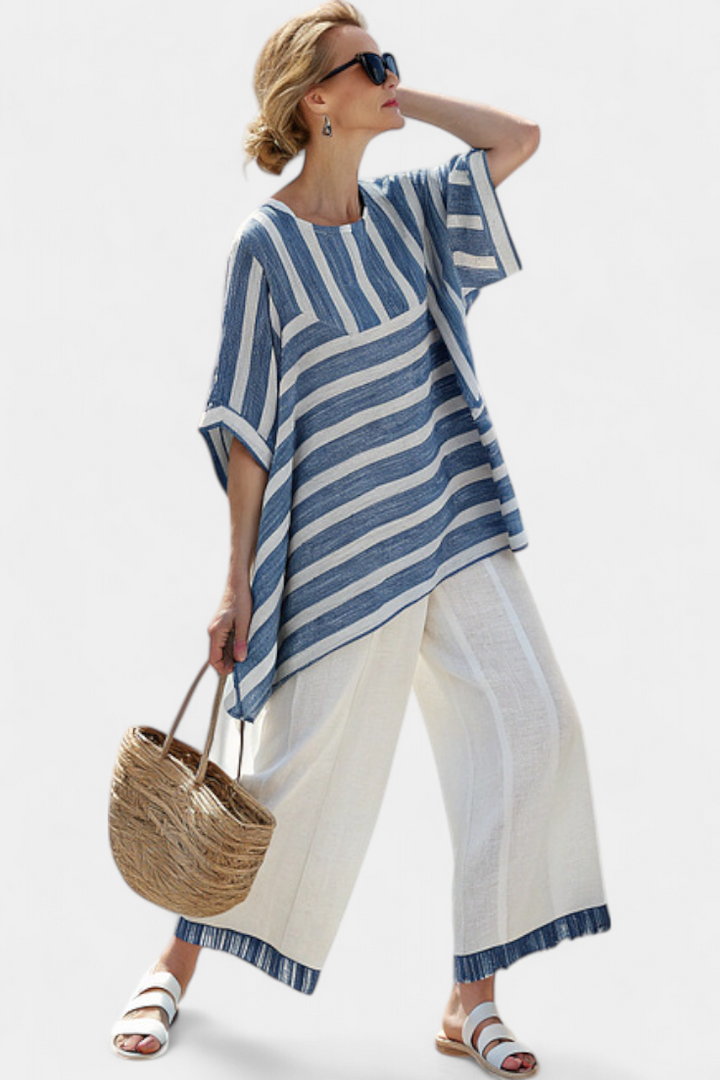 Relaxed women's striped batwing sleeve top & flowing wide leg pant set. Ideal for summer casual elegance.