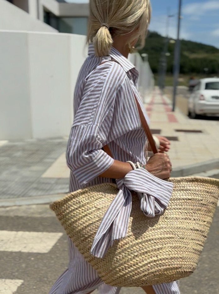 Stylish striped button-front shirt dress for women. Relaxed fit midi length makes it ideal for everyday or beach wear.