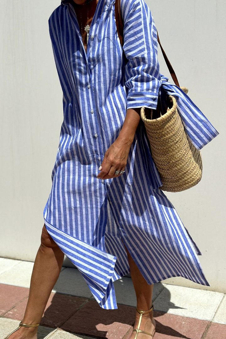 Lightweight striped midi shirt dress, collared, button-down, and oversized, ideal for summer fashion.