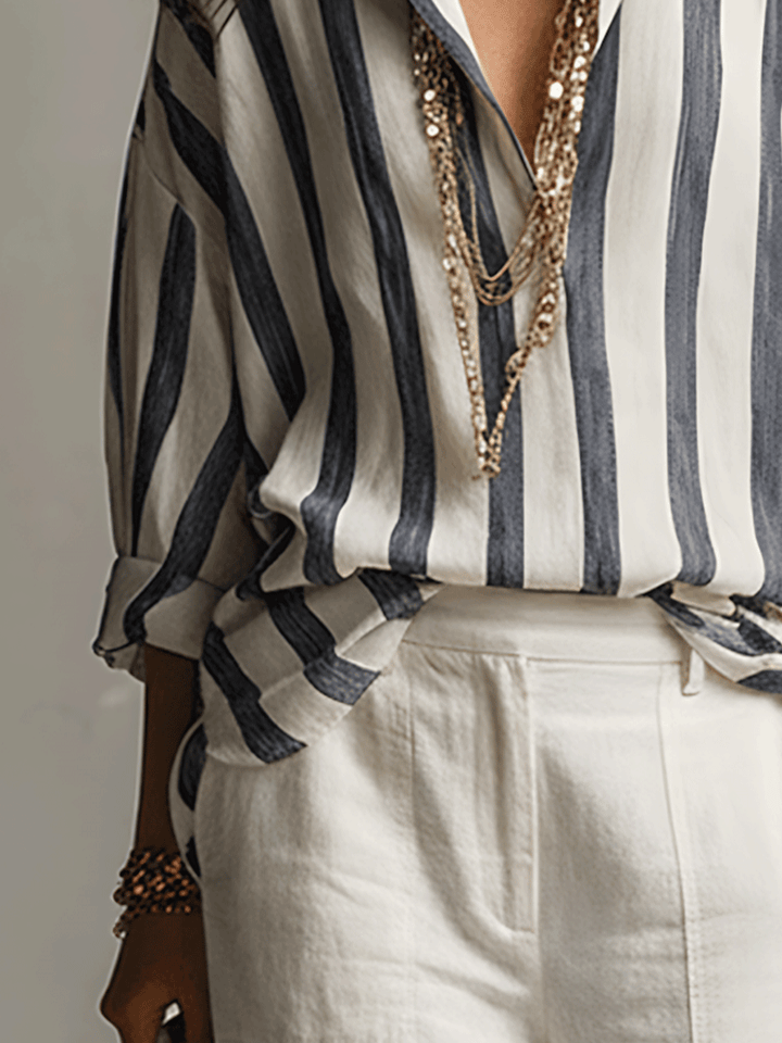Modern women's striped long sleeve blouse, button-front design, essential for versatile fashion.
