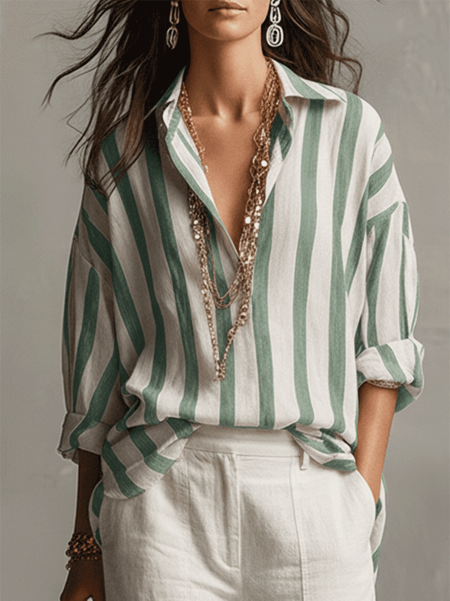 Stylish women's long sleeve striped blouse, button-front design, great for casual elegance.