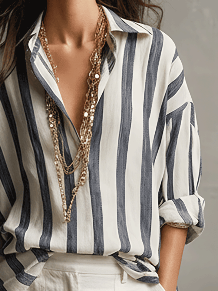 Elegant women's striped button-up long sleeve shirt, perfect for a refined everyday look.